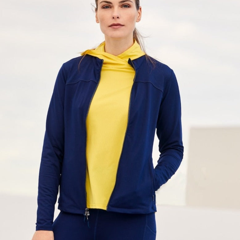 Image showing a woman wearing the Navy Nova Powerstretch Jersey Jacket layered over a yellow mesh Get Up and Go Hoodie and Navy Leggings