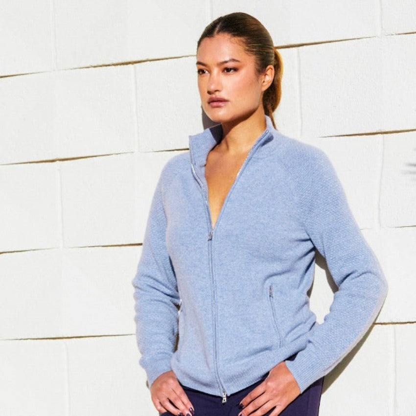 Victoria Cashmere Bomber. Experience the ultimate in sustainable comfort and quiet luxury  for every day. Victoria is perfect for travel and resort lifestyle elegant layering. IDEAL Earth friendly xippers. 2 side pockets, 2-way full zip premium zippers.  12 gg luxurious jersey and contrast honeycomb  stitch. Model is 5'8 and wearing size M.