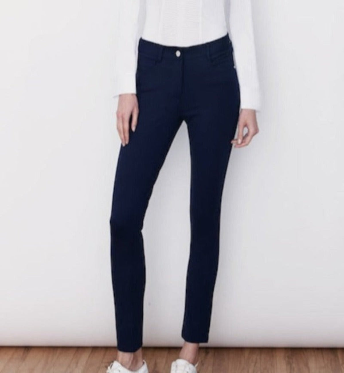 This photo shows the Jersey Stretch 5-Pocket Eliza Tailored Pant in Navy. This classic jean-style tailored knit pant features a front zipper closure, a sturdy shank button and belt loops. Featuring sustainable repurposed materials and Earth Friendly IDEAL Fastener Company Zippers.